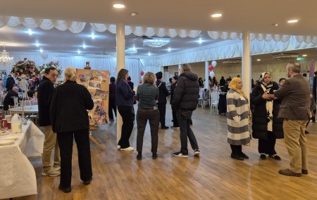 Carers stood networking and enjoying a buffet to mark national Carers Rights Day.
