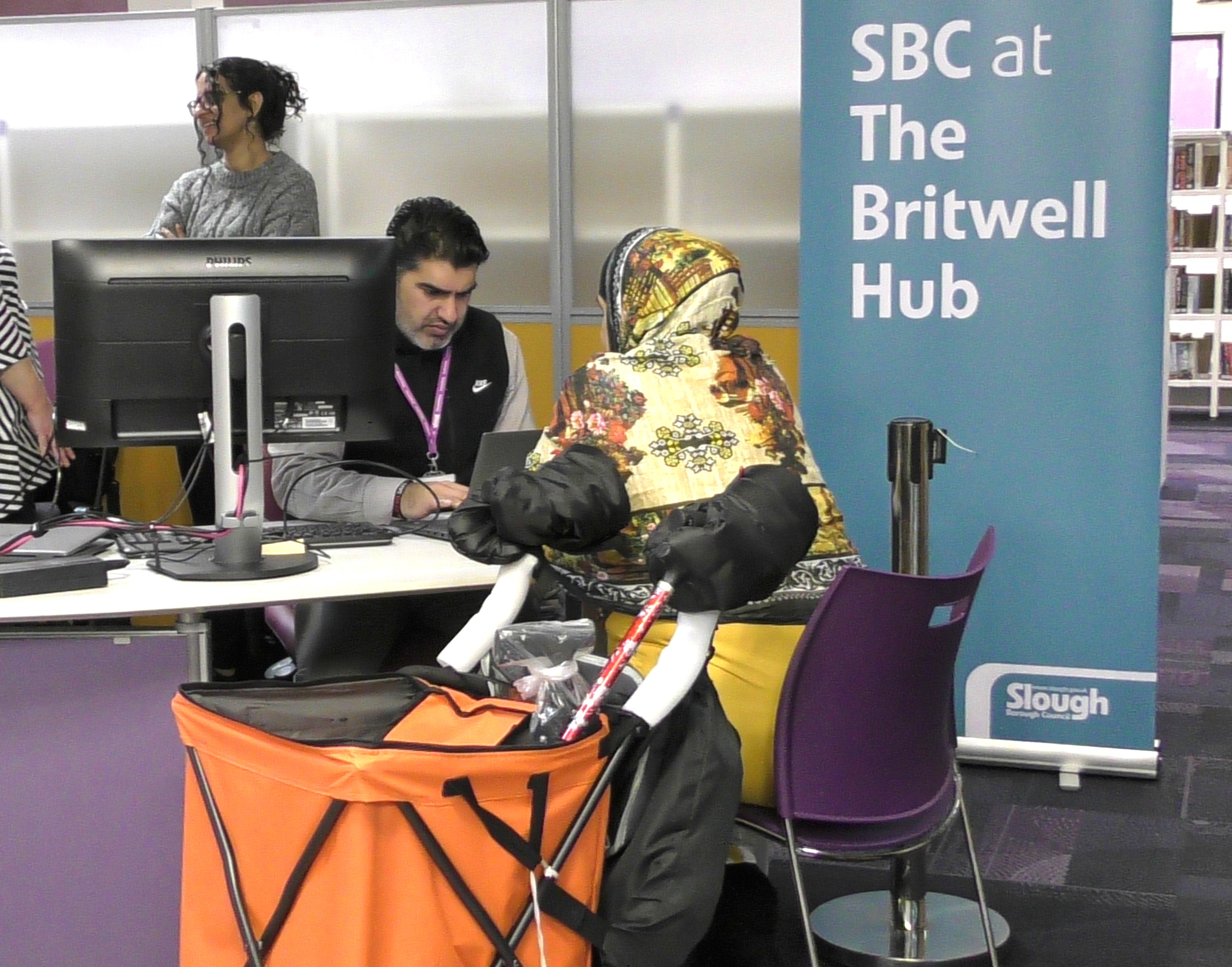 Image of a customer talking to an advisor at SBC at The Britwell Hub