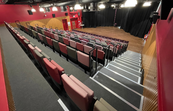 Photo of The Venue room at The Curve, Slough showing the raked seating, which can also be folded away