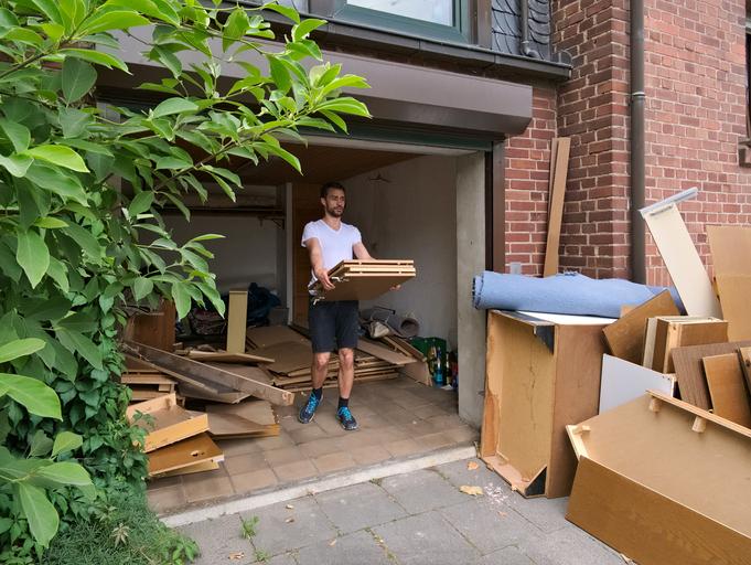 Someone clearing DIY waste