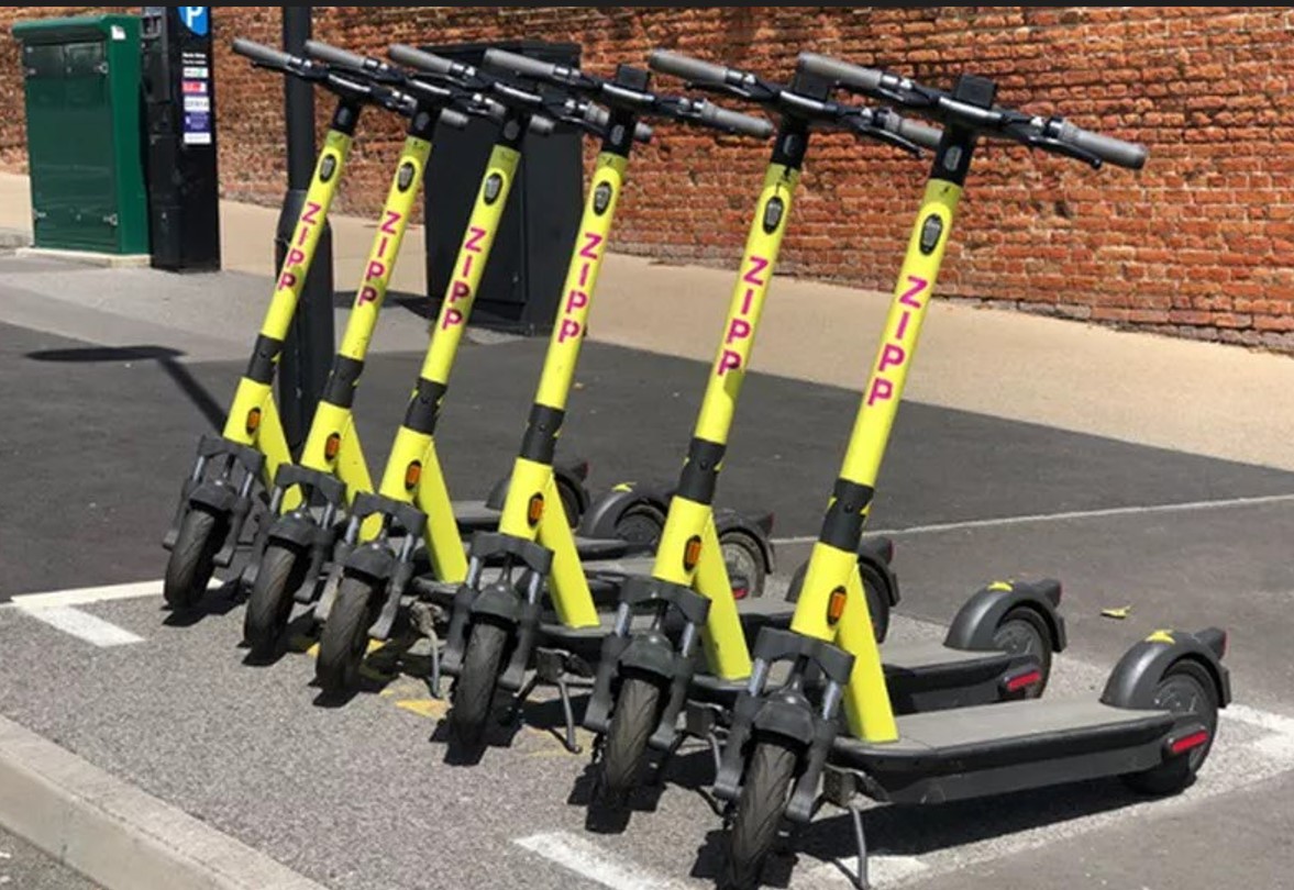 A yellow Zipp scooter for hire