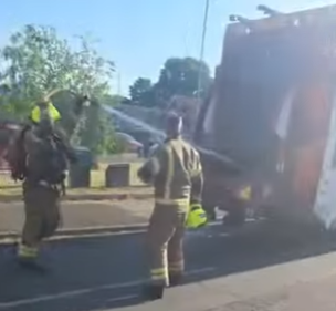 Image of royal berkshire fire and rescue extinguishing a fire in a bin lorry